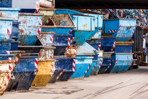Front view of a skip hire truck in a residential street in St Johns Wood