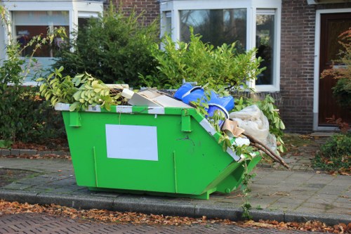 Man and van departing after rubbish removal in a residential street